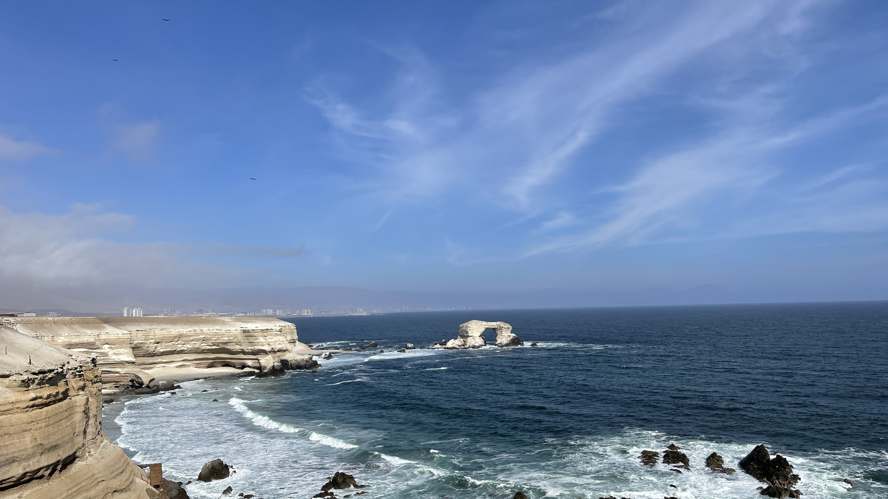 La Portada's natural stone arch off the Antofagasta coast, seen from the clifftop.